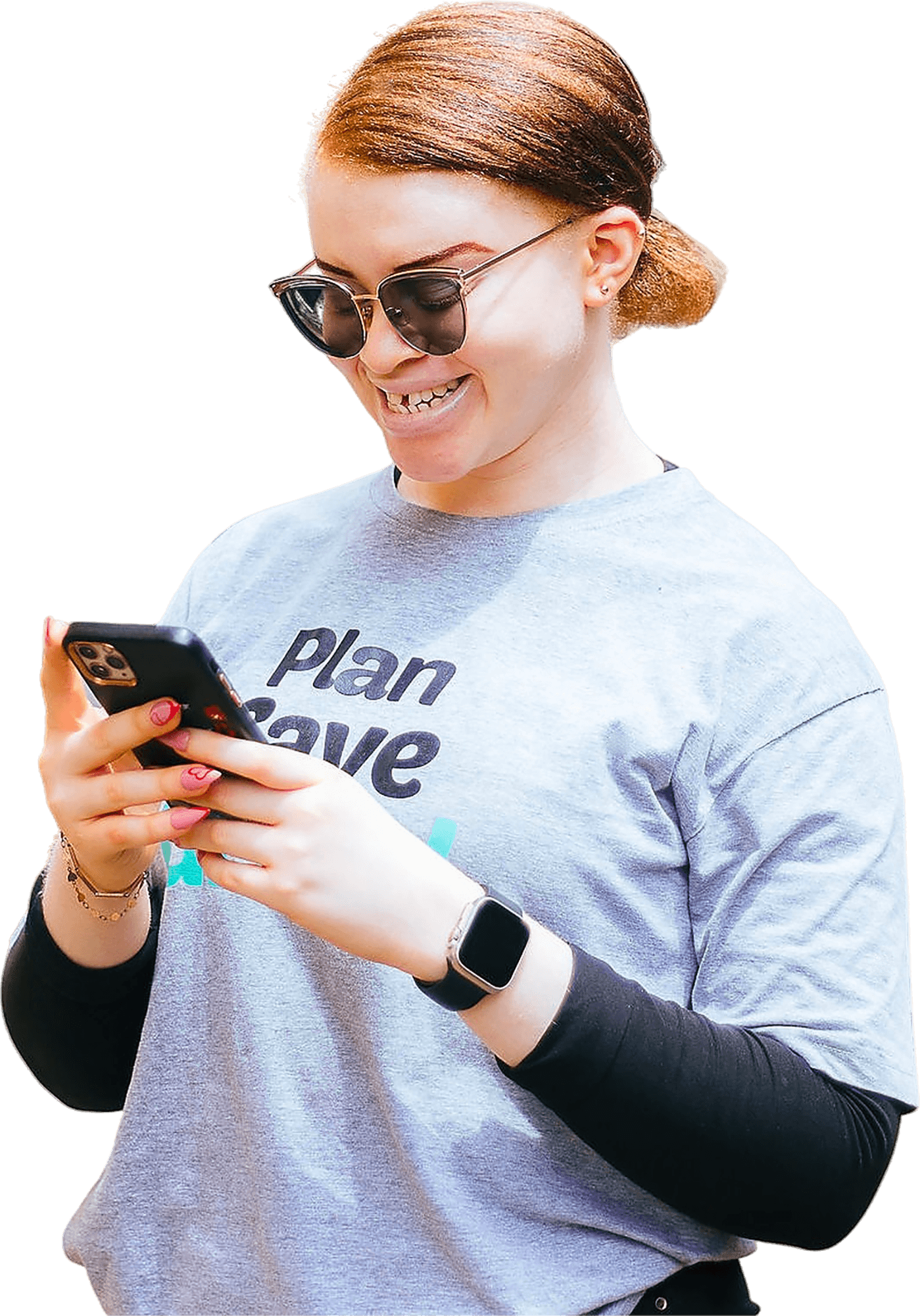 A person smiling while using the Nkwa app on their phone